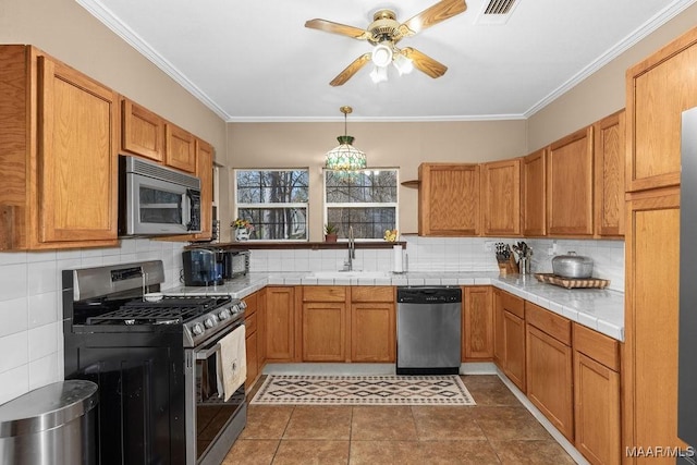 212 N Taylor St, Autaugaville, AL 36067 - kitchen with visible vents, ceiling fan, a sink, appliances with stainless steel finishes, and crown molding