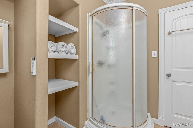 212 N Taylor St, Autaugaville, AL 36067 - bathroom featuring baseboards and a stall shower