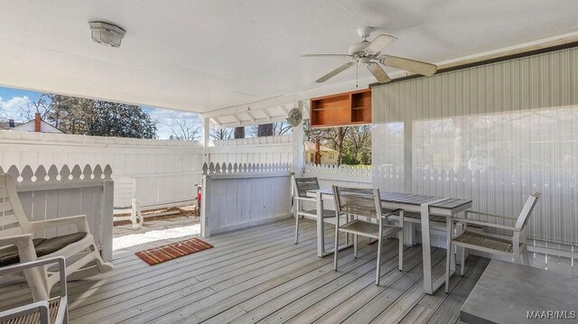 212 N Taylor St, Autaugaville, AL 36067 - deck featuring outdoor dining area, a fenced backyard, and ceiling fan