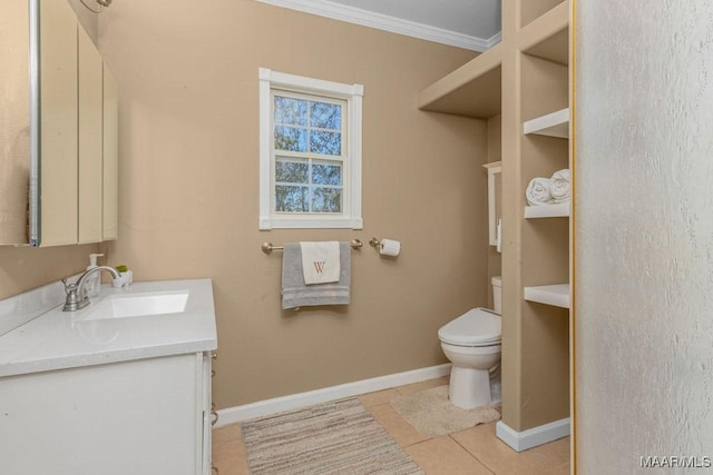 212 N Taylor St, Autaugaville, AL 36067 - bathroom with tile patterned floors, toilet, ornamental molding, baseboards, and vanity