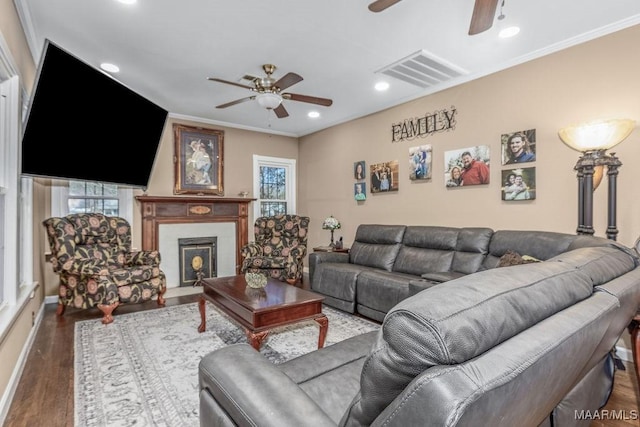 212 N Taylor St, Autaugaville, AL 36067 - living area with crown molding, wood finished floors, visible vents, and ceiling fan