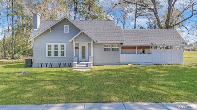 212 N Taylor St, Autaugaville, AL 36067 - view of front of property featuring central AC, a chimney, a front yard, and roof with shingles