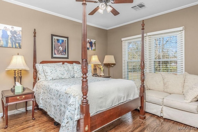 212 N Taylor St, Autaugaville, AL 36067 - bedroom with visible vents, ceiling fan, baseboards, ornamental molding, and wood finished floors