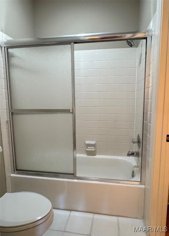 8518 Plantation Ridge Rd, Montgomery, AL 36116 - full bath with tile patterned floors, combined bath / shower with glass door, and toilet