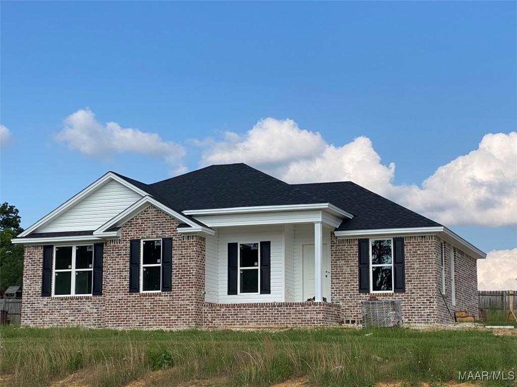 20 Autumn Trail Cir, Wetumpka, AL 36092 - view of front of house with brick siding, central AC unit, and roof with shingles