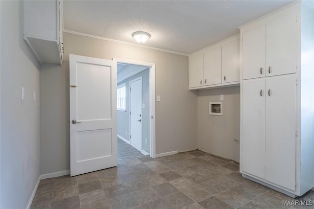 3740 Fieldcrest Dr, Montgomery, AL 36111 - laundry area with cabinet space, hookup for a washing machine, a textured ceiling, baseboards, and ornamental molding