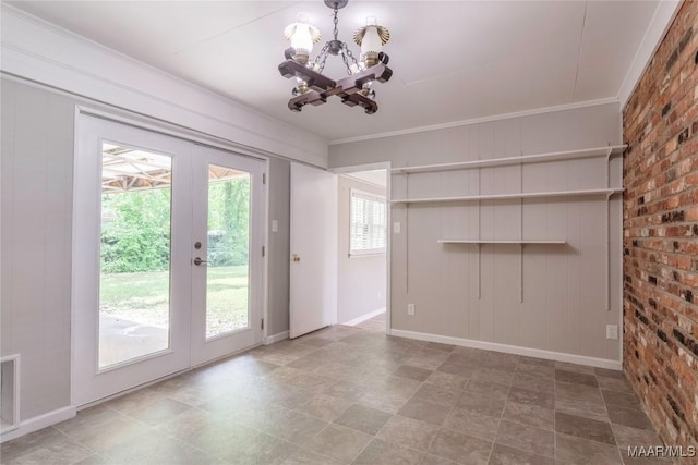 3740 Fieldcrest Dr, Montgomery, AL 36111 - unfurnished dining area featuring a chandelier, crown molding, french doors, and baseboards