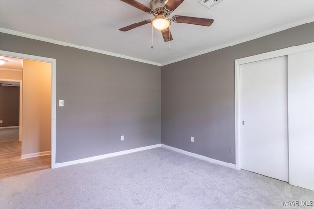 3740 Fieldcrest Dr, Montgomery, AL 36111 - unfurnished bedroom featuring ornamental molding, carpet, baseboards, a closet, and a ceiling fan