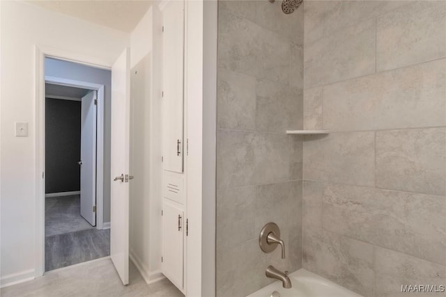 3740 Fieldcrest Dr, Montgomery, AL 36111 - bathroom featuring shower / tub combination and baseboards