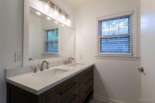 3740 Fieldcrest Dr, Montgomery, AL 36111 - full bathroom featuring healthy amount of natural light, double vanity, and baseboards