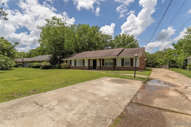 3740 Fieldcrest Dr, Montgomery, AL 36111 - ranch-style home featuring a front lawn, concrete driveway, and brick siding