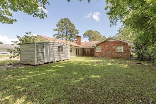 3740 Fieldcrest Dr, Montgomery, AL 36111 - rear view of house featuring a chimney and brick siding