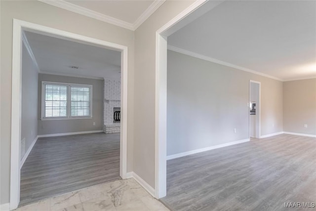 3740 Fieldcrest Dr, Montgomery, AL 36111 - unfurnished room featuring crown molding, baseboards, wood finished floors, and a fireplace