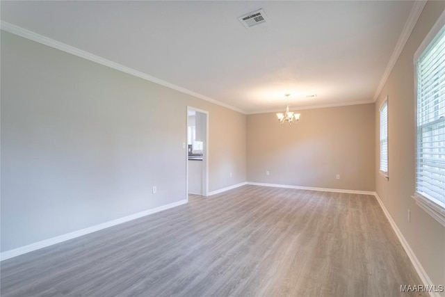3740 Fieldcrest Dr, Montgomery, AL 36111 - unfurnished room with light wood-type flooring, a chandelier, crown molding, and baseboards