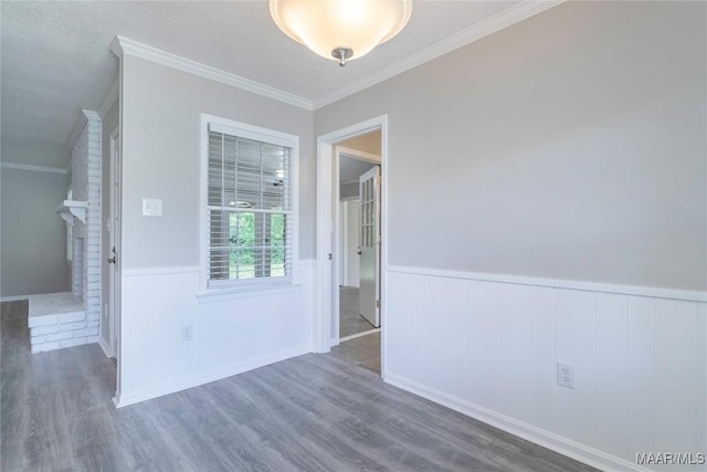 3740 Fieldcrest Dr, Montgomery, AL 36111 - empty room with wood finished floors, a wainscoted wall, and ornamental molding