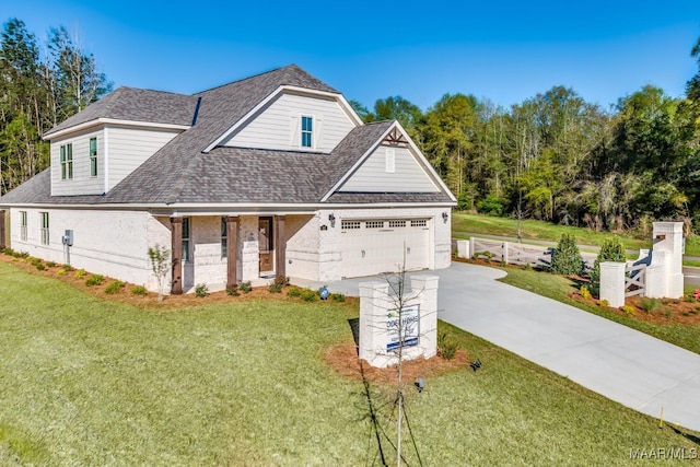 101 Ananias St, Troy, AL 36079 - view of front facade featuring driveway, brick siding, roof with shingles, and a front yard