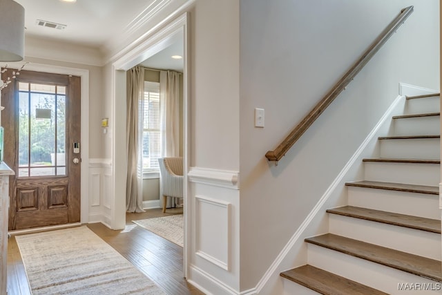 101 Ananias St, Troy, AL 36079 - entryway with stairs, wood finished floors, wainscoting, visible vents, and ornamental molding