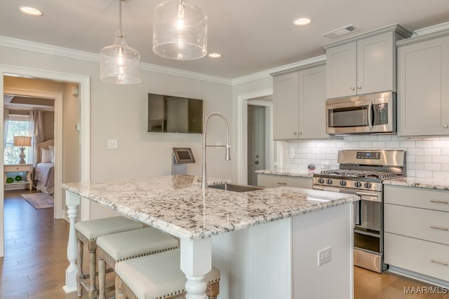101 Ananias St, Troy, AL 36079 - kitchen featuring a sink, stainless steel appliances, crown molding, and tasteful backsplash