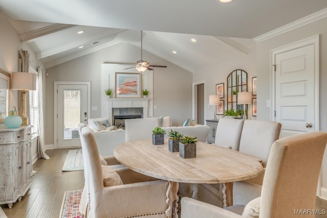 101 Ananias St, Troy, AL 36079 - dining room with recessed lighting, light wood-style floors, a ceiling fan, vaulted ceiling with beams, and a fireplace