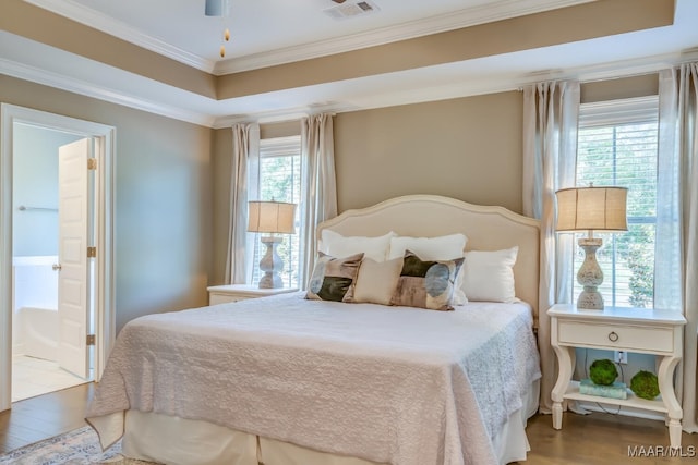 101 Ananias St, Troy, AL 36079 - bedroom featuring visible vents, crown molding, wood finished floors, and a raised ceiling