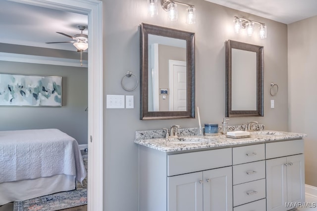 101 Ananias St, Troy, AL 36079 - ensuite bathroom with double vanity, connected bathroom, a sink, and ceiling fan