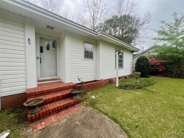 89 First Ave, Luverne, AL 36049 - view of exterior entry with a yard