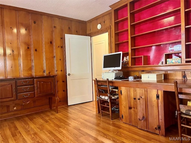 89 First Ave, Luverne, AL 36049 - office featuring light wood-style floors, wood walls, built in study area, a textured ceiling, and crown molding