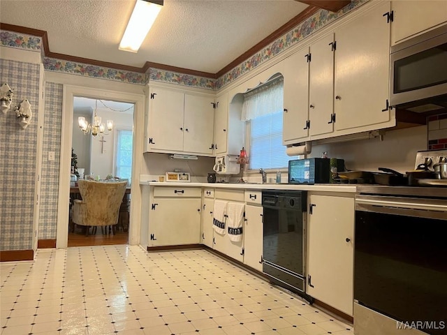 89 First Ave, Luverne, AL 36049 - kitchen with stainless steel microwave, black dishwasher, dishwashing machine, healthy amount of natural light, and a textured ceiling