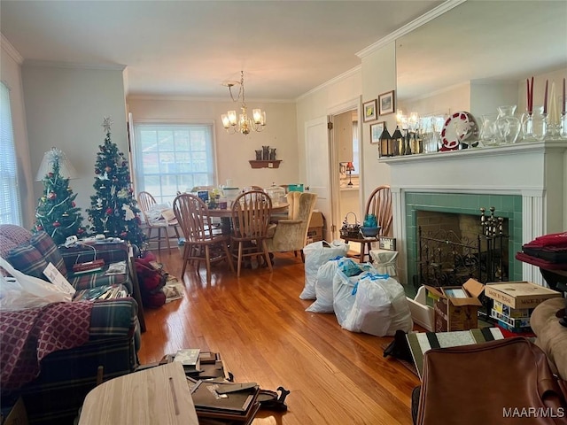 89 First Ave, Luverne, AL 36049 - living area featuring a chandelier, wood finished floors, crown molding, and a tiled fireplace