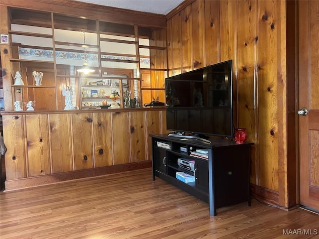 89 First Ave, Luverne, AL 36049 - kitchen with light wood finished floors, wood walls, and brown cabinetry
