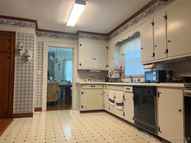 89 First Ave, Luverne, AL 36049 - kitchen featuring black dishwasher, a textured ceiling, light countertops, light flooring, and ornamental molding