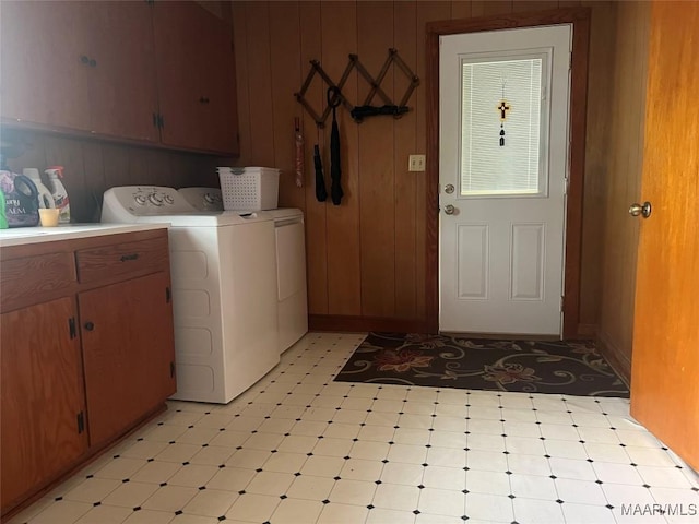 89 First Ave, Luverne, AL 36049 - washroom featuring cabinet space, light floors, washer and dryer, and wooden walls
