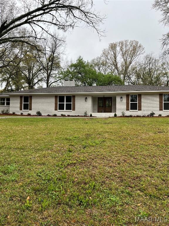 267 County Road 65th Rd, Valley Grande, AL 36701 - ranch-style house with a front yard and brick siding