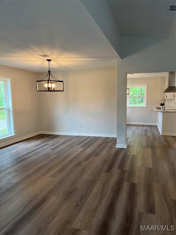 267 County Road 65th Rd, Valley Grande, AL 36701 - unfurnished dining area featuring plenty of natural light, dark wood finished floors, and a chandelier