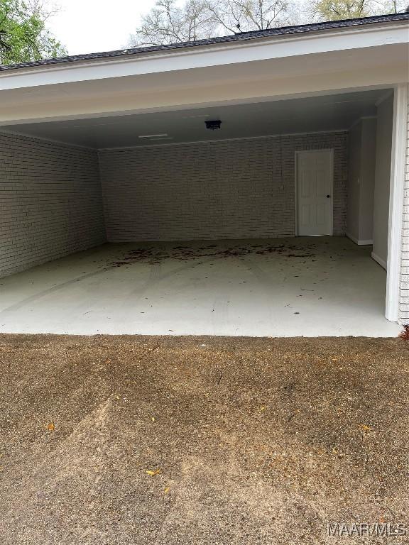 267 County Road 65th Rd, Valley Grande, AL 36701 - garage featuring a carport