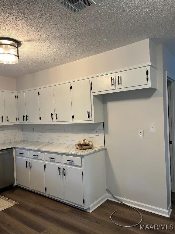 267 County Road 65th Rd, Valley Grande, AL 36701 - kitchen with dishwasher, dark wood finished floors, decorative backsplash, and a textured ceiling