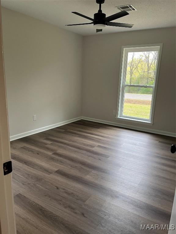 267 County Road 65th Rd, Valley Grande, AL 36701 - empty room with ceiling fan and dark wood-type flooring