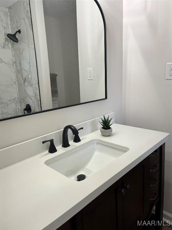 267 County Road 65th Rd, Valley Grande, AL 36701 - full bathroom with vanity and a marble finish shower