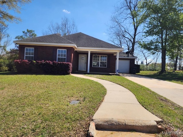 view of front of property with an attached garage, a front lawn, and concrete driveway