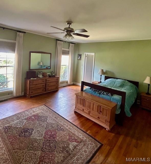 bedroom featuring wood finished floors and ceiling fan