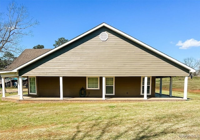 376 Mckenzie St, Mckenzie, AL 36456 - back of property with roof with shingles, a yard, and a patio