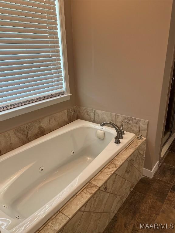 376 Mckenzie St, Mckenzie, AL 36456 - bathroom featuring a whirlpool tub