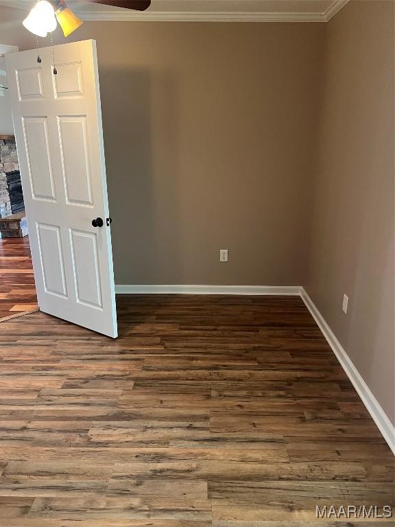 376 Mckenzie St, Mckenzie, AL 36456 - spare room featuring a ceiling fan, ornamental molding, baseboards, and wood finished floors