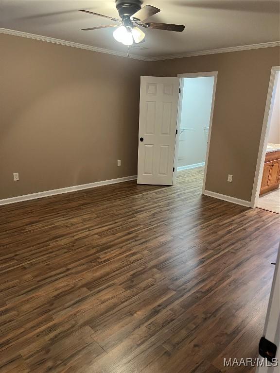 376 Mckenzie St, Mckenzie, AL 36456 - spare room with dark wood finished floors, ornamental molding, baseboards, and ceiling fan