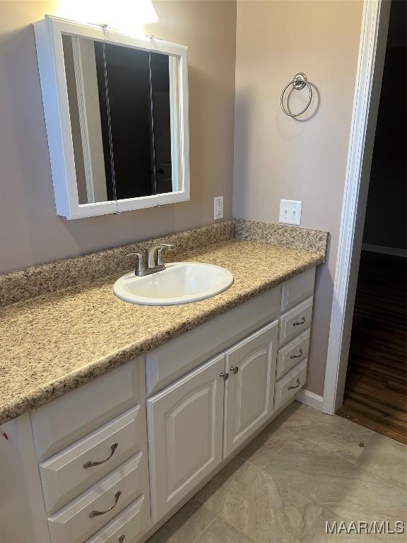 376 Mckenzie St, Mckenzie, AL 36456 - bathroom with baseboards and vanity