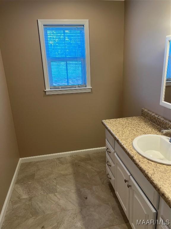 376 Mckenzie St, Mckenzie, AL 36456 - bathroom with vanity and baseboards