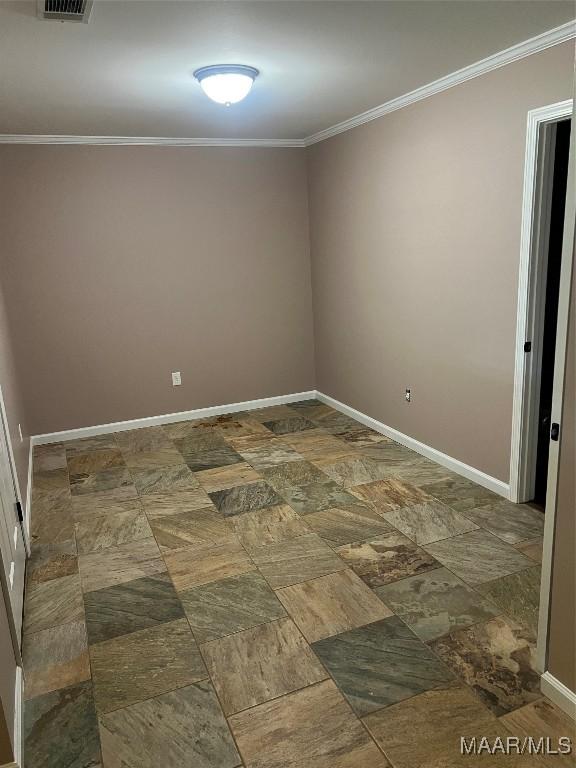 376 Mckenzie St, Mckenzie, AL 36456 - spare room featuring baseboards, visible vents, and crown molding