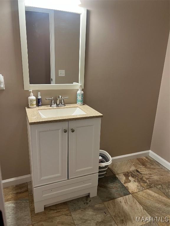 376 Mckenzie St, Mckenzie, AL 36456 - bathroom with baseboards and vanity