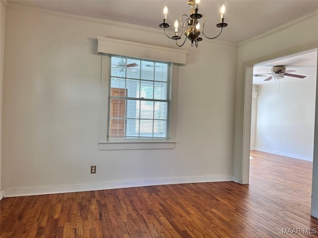 empty room featuring baseboards, ceiling fan with notable chandelier, wood finished floors, and ornamental molding