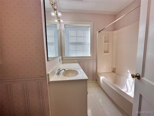 bathroom featuring shower / washtub combination, wallpapered walls, vanity, and ornamental molding